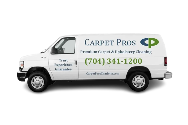 A white van with the words " carpet pros " written on it.